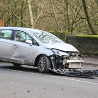 Car wreck from road debris