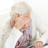 Senior lady unhappy with finances.jpg.crdownload
