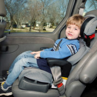 Child strapped to car seat