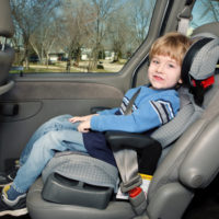 Child strapped to car seat Child strapped to car seat