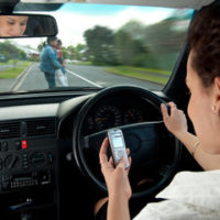 lady distracted while in car