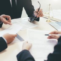 Law, advice and Legal services concept. Lawyer and attorney having team meeting at law firm. Law, advice and Legal services concept. Lawyer and attorney having team meeting at law firm.