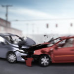 Grey and red car crash