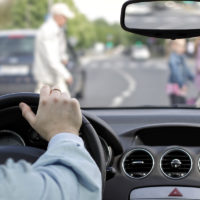 Driver and pedestrian at crosswalk